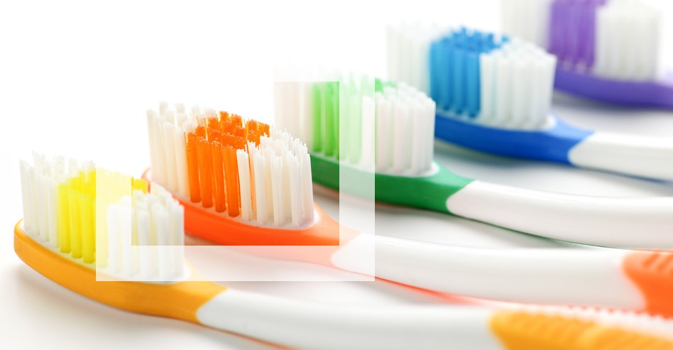 colored bristles on a manual toothbrush